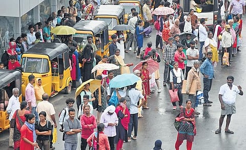 Unexpected rain on Monday caught road users unawares in Tambaram. (Photo | D SAMPATHKUMAR, EPS)
