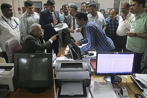 Lokayukta Justice BS Patil (seated) at the office of the Deputy Director of Land Records of Bengaluru Urban District in Benglauru on Monday | Vinod Kumar T