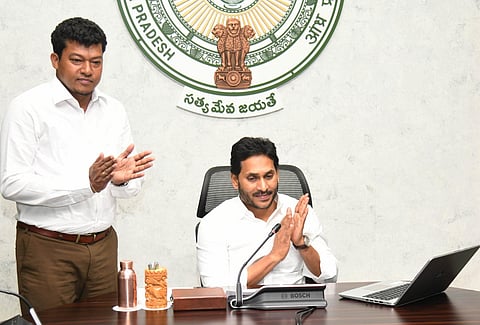 Andhra CM Jagan Mohan Reddy lays the foundation stone for the fish landing center and rejuvenation of Pulicat Lake, besides disbursing financial assistance to fishermen virtually. (Express)