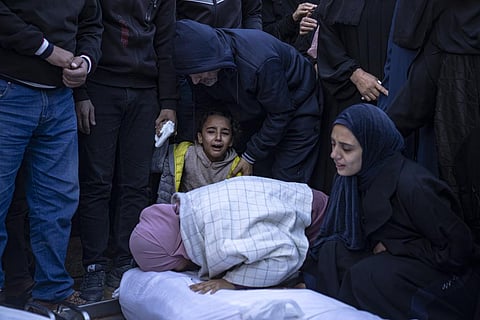 Palestinians mourn their relatives killed in the Israeli bombardment of the Gaza Strip, in the hospital in Khan Younis, Tuesday, Nov. 21, 2023. (AP)
