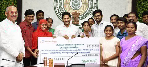 Chief Minister YS Jagan Mohan Reddy distributes Rs 81.64 crore to 10,511 couples under the YSR Kalyanamasthu programme on Thursday. (Express)