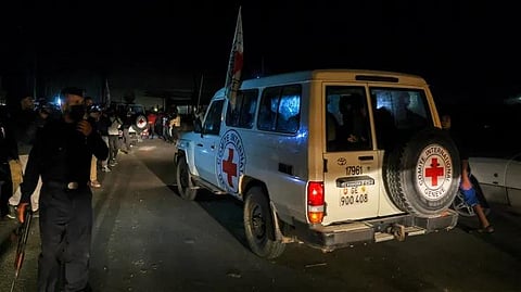 International Red Cross vehicles reportedly carrying hostages released by Hamas cross the Rafah border point in the Gaza Strip on the way to Egypt, on November 24, 2023. (Photo | AFP)