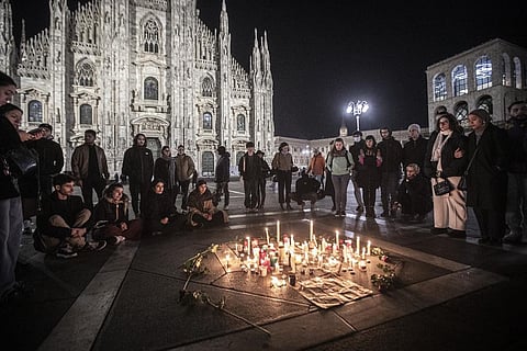 People attend a candlelight vigil for 22-year-old Giulia Cecchettin, allegedly killed at the hands of her possessive ex-boyfriend, in front of the Milan Duomo Cathedral, Italy. (Photo | AP)