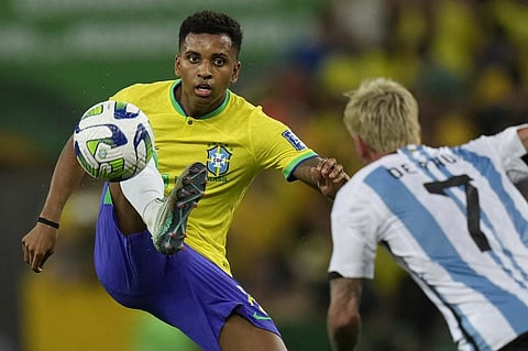 Brazil's Rodrygo controls the ball challenged by Argentina's Rodrigo De Paul during a qualifying soccer match for the FIFA World Cup 2026 on Nov. 21, 2023. (Photo | AP)