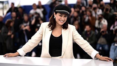 Tunisian actress Hend Sabri poses for photos at the 2023 Cannes Film Festival. (Photo | AFP)