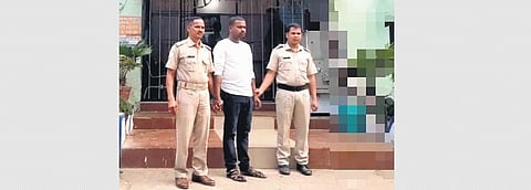 K Ganesh Patra at the police station | Express