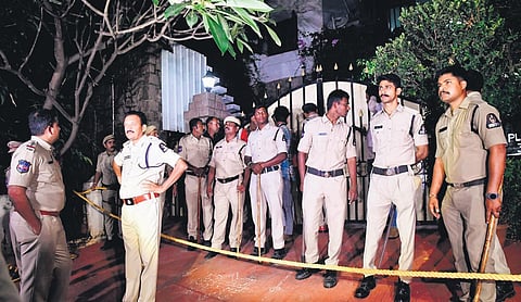 Jubilee Hills police are seen outside retired IAS officer AK Goel’s residence in Hyderabad on Friday. (Photo | EPS)