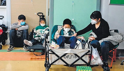 Children on drips at a hospital in Beijing on Thursday. China has reported an increase in influenza-like illness since mid-October, the WHO said.