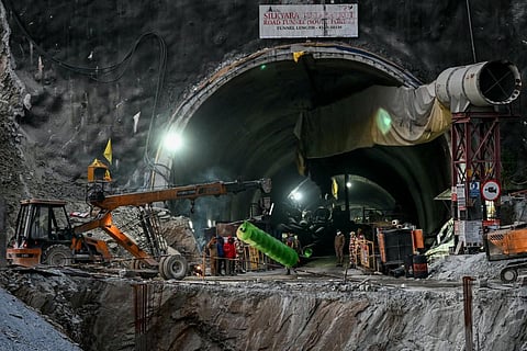 FILE - A crane carries a part of a drilling machine during rescue operations for workers trapped in the Silkyara under-construction road tunnel in Uttarkashi district, Nov 22, 2023. (Photo | AFP)