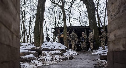 Soldiers of Ukraine's state border guard discuss the agenda at a military position in the Sumy region, Ukraine. (Photo | AP)