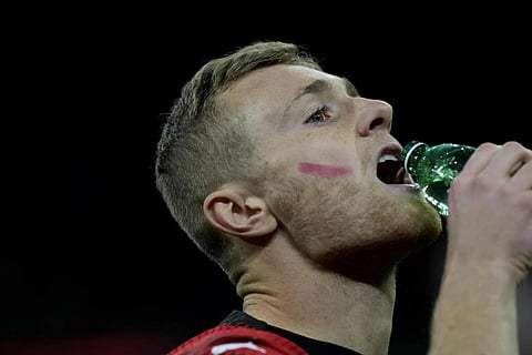 A red mark painted on the face on AC Milan's Tommaso Pobega to promote International Day for the Elimination of Violence against Women during a Serie A soccer match, Italy, Nov 25, 2023. (Photo | AP)