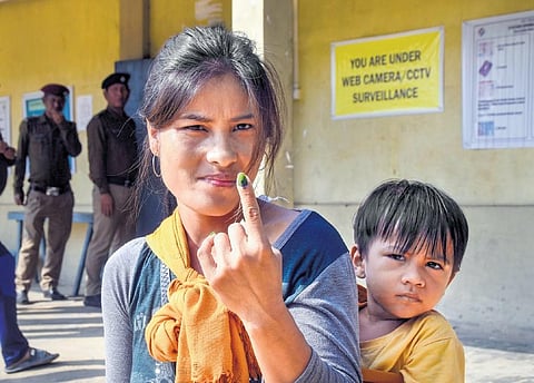 A voter after casting her vote for Mizoram Assembly elections in Mamit district. (Photo | PTI)