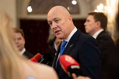 New Zealand's new Prime Minister Christopher Luxon speaks to the media during the swearing-in of the new government at Government House in Wellington on November 27, 2023. (Photo | AFP)