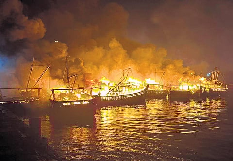 Gutted boats at Visakhapatnam Fishing Harbour following a major fire outbreak on Monday morning. (Photo | Express)