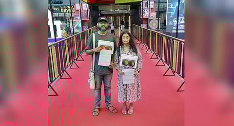 The two delegates from Kerala peacefully protesting against the screening of director Sudipto Sen’s controversial film 'The Kerala Story' at the 54th IFFI in Goa. (Photo | Sreenath Instagram)