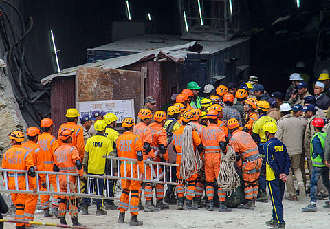 NDRF personnel on standby at the entrance of the Silkyara Bend-Barkot Tunnel on Tuesday. (Photo | PTI)