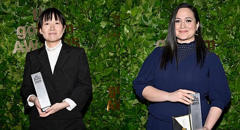 Celine Song and Lily Gladstone pose with their trophies at the Gotham Independent Film Awards at Cipriani Wall Street on Monday, Nov. 27, 2023, in New York. (AP)