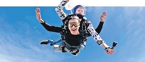 Russian instructor Nikolai Demeshev performs a Tandem jump