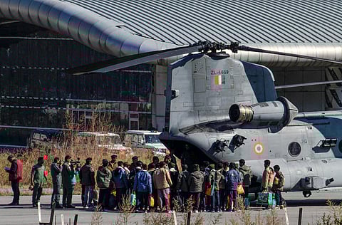 Rescued workers from the Silkyara Tunnel being airlifted to AIIMS Rishikesh aboard Indian Air Force's (IAF) Chinook helicopter on Wednesday. (Photo | PTI)