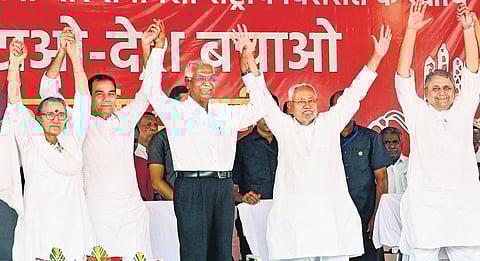 Bihar CM Nitish Kumar with CPI general secretary D Raja at ‘BJP Hatao Desh Bachao’ rally in Patna on Thursday | pti