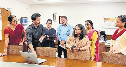 Students explaining the findings of their study to Kozhikode Mayor Beena Philip and other officials