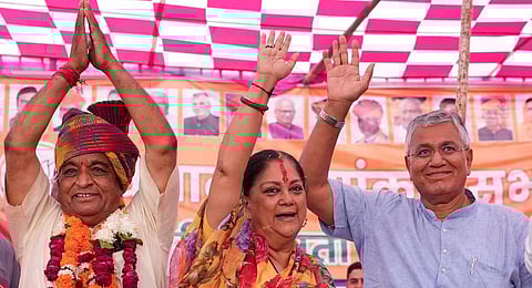 ormer Chief Minister Vasundhara Raje with BJP candidate from Bilara constituency Arjunlal Garg and Bhopalgarh constituency Kamsa Meghwal during a rally in Jodhpur district on Nov. 2, 2023. (PTI)