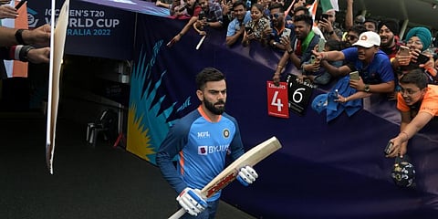 Virat Kohli walks past spectators as he prepares to warm up ahead of the start of the ICC men's Twenty20 World Cup 2022 semi-final.(File Photo | AFP)