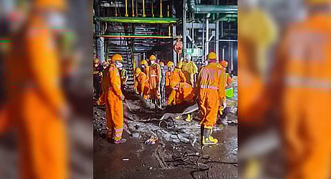 NDRF personnel during a search and rescue operation after a fire broke out following an explosion at a pharmaceutical company, in Maharashtra's Raigad district. (Photo | PTI)