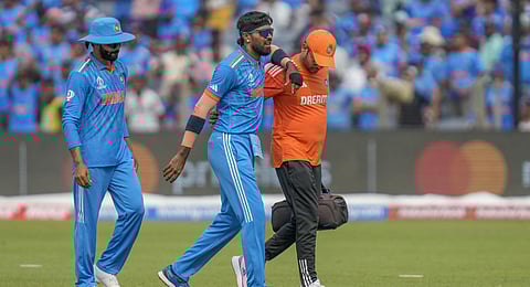 Hardik Pandya, center, walks off the field after sustaining an injury during the ICC Men's Cricket World Cup against Bangladesh.(Photo | AP)
