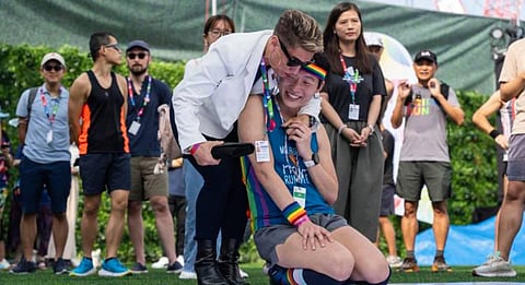 Participants react at the AIDS Quilt Memorial Ceremony, ahead of the Gay Games in Hong Kong. (Photo | Associated Press)