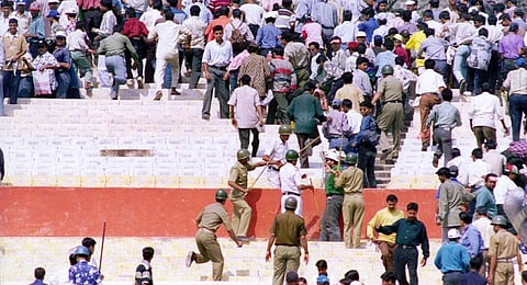 Calcutta police chase spectators out of the stadium to clear the stands after trouble erupted as the spectators started throwing water bottles and stones onto the playing field.(File | AFP))