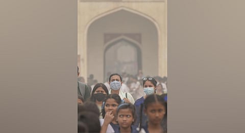 ourists visit the Humayun Tomb amid low visibility due to smog, in New Delhi. (Photo | PTI)