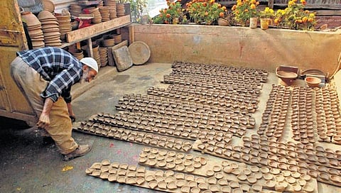 Muhammad Umar works at his pottery unit in Nishat in the outskirts of Srinagar