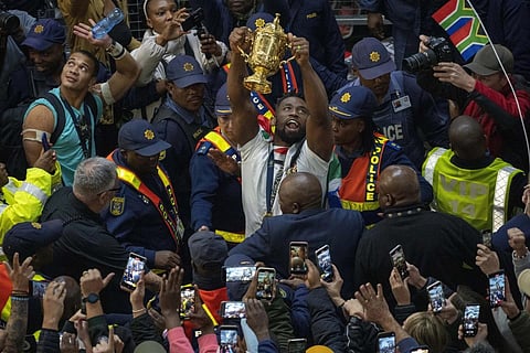 South Africa's Springbok captain Siya Kolisi holds the Webb Ellis cup at O.R.Tambo's international airport in Johannesburg, Oct 31, 2023. (Photo | AP)