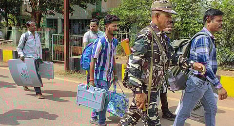 Polling officials with EVMs and other election material leave for poll duty ahead of Chhattisgarh Assembly elections, at Jagdalpur in Bastar district, Monday, Nov. 6, 2023. (PTI)