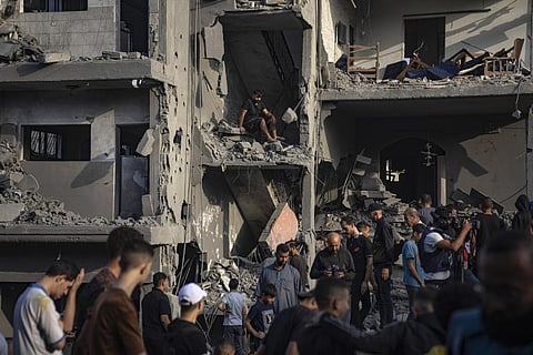 Palestinians look for survivors of the Israeli bombardment of the Gaza Strip in Maghazi refugee camp on Sunday. (Photo | AP)