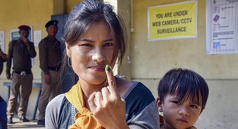A voter shows her finger marked with indelible ink after casting her vote for Mizoram Assembly elections, in Mamit district, Tuesday, Nov. 7, 2023.(Photo | PTI)