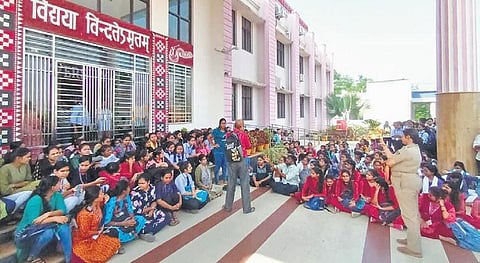 Students staging dharna outside the administrative block on Tuesday | Express