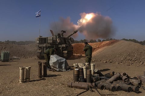 An Israeli mobile artillery unit fires a shell from southern Israel towards the Gaza Strip, in a position near the Israel-Gaza border, Nov. 6, 2023. (AP)