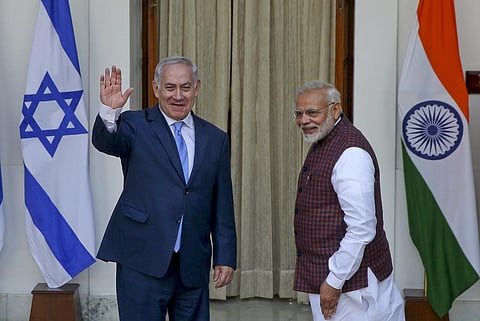 FILE- India's Prime Minister Narendra Modi, right gestures and Israeli Prime Minister Benjamin Netanyahu waves to the media as they arrive for a meeting in New Delhi, India, Jan.15, 2018. (Photo | AP)