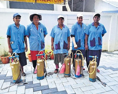 The women sanitation workers of Kochi corporation with the spraying equipment they use to eradicate scourge of mosquitoes plaguing the city