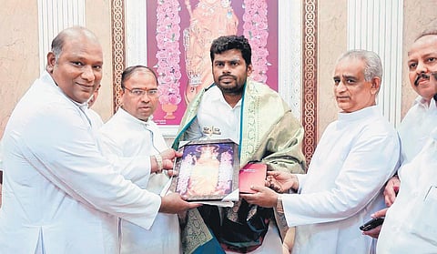 BJP state president K Annamalai with priests of Velankanni Basilica during his visit to the shrine on Thursday. (Photo | Express)