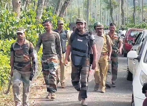Forest officials patrolling at Vakeri in Wayanad where a man was killed in tiger attack on Saturday