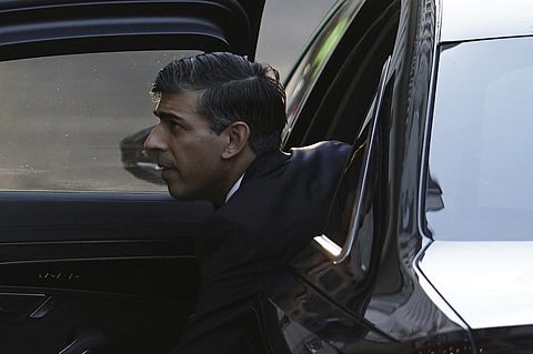 Britain's Prime Minister Rishi Sunak arrives to give evidence to the UK COVID-19 Inquiry during its second investigation, at Dorland House in London, Monday, Dec. 11, 2023. (AP Photo)