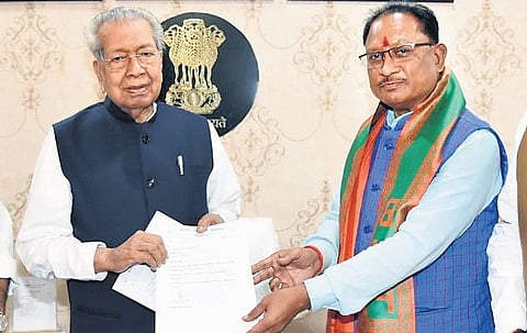 Chhattisgarh CM-designate Vishnu Deo Sai (R) meets State Governor Biswabhusan Harichandan to stake claim to form government, at the Raj Bhavan on Sunday | ANI