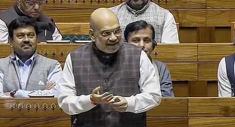 Union Home Minister Amit Shah speaks in the Lok Sabha during the Winter session of Parliament, in New Delhi, Tuesday, Dec. 12, 2023. (PTI Photo)