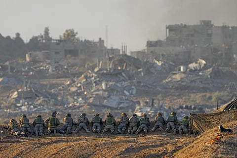 Israeli soldiers take positions near the Gaza Strip border, in southern Israel, Monday, Dec. 11, 2023. (Photo | AP)
