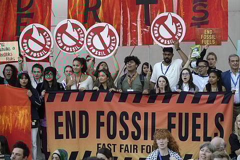 Activists participate in a demonstration against fossil fuels at the COP28 UN Climate Summit, Tuesday, Dec. 12, 2023, in Dubai, United Arab Emirates. (AP Photo)