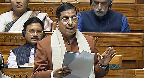 Parliamentary Affairs Minister Pralhad Joshi speaks in the Lok Sabha during the Winter session of Parliament, in New Delhi, Thursday, Dec. 14, 2023. (PTI Photo)