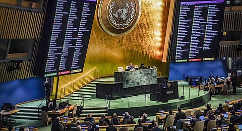 Display monitors show the result of voting in the UN General Assembly, in favor of a resolution calling on Israel to uphold legal and humanitarian obligations in its war with Hamas, Dec. 12, 2023. (AP